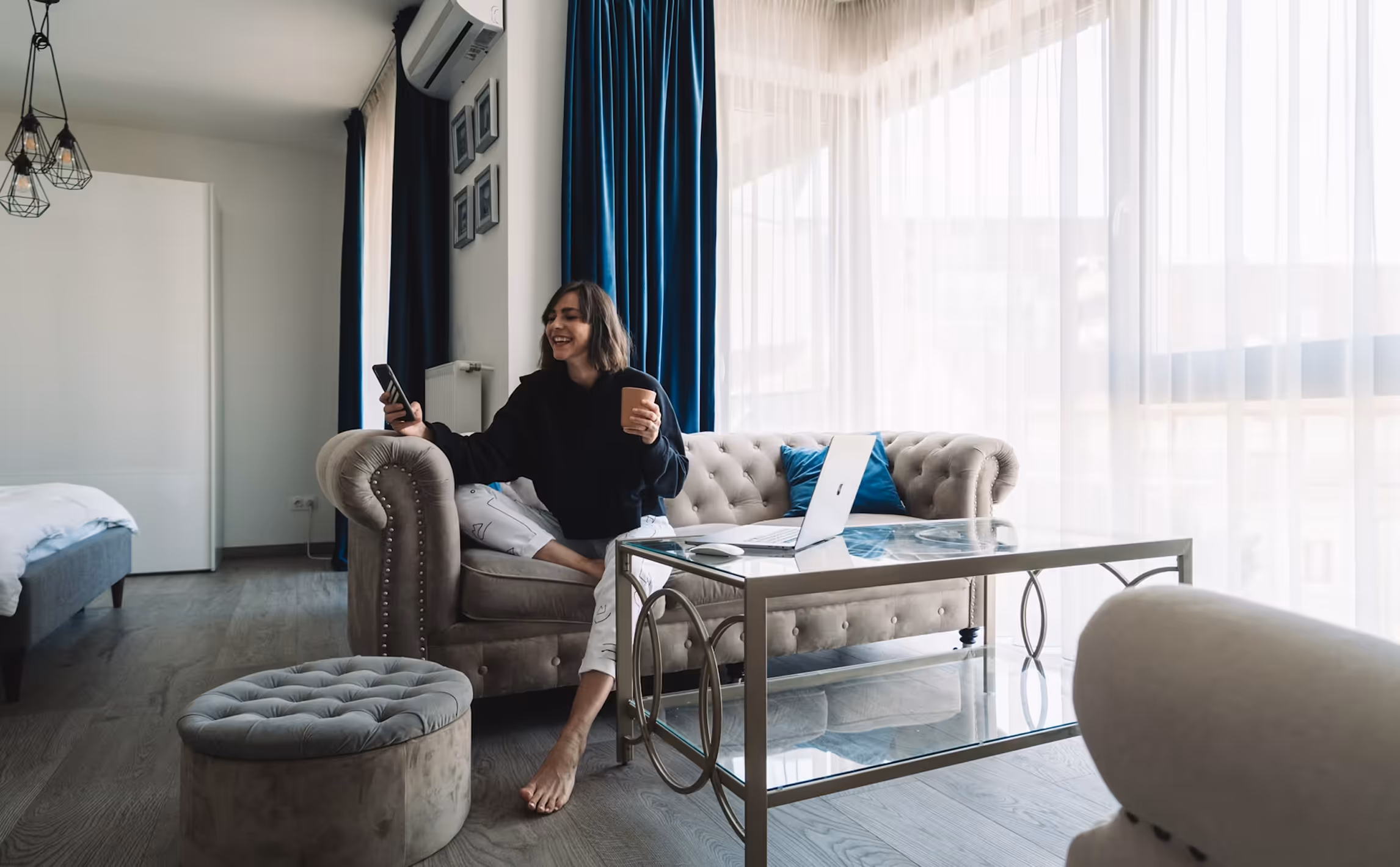 Working remotely from a couch with a laptop